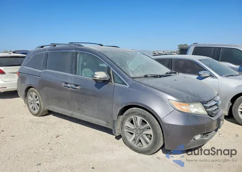 2014 Honda Odyssey Touring z USA, uszkodzony, nr VIN 5FNRL5H94EB009890